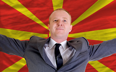 Image showing happy businessman because of profitable investment in macedonia 