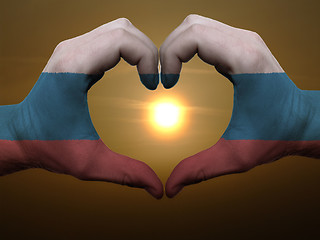 Image showing Heart and love gesture by hands colored in russia flag during be
