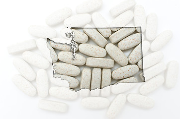 Image showing Outline map of washington with transparent pills in the backgrou