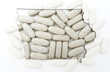 Image showing Outline map of Iowawith transparent pills in the background