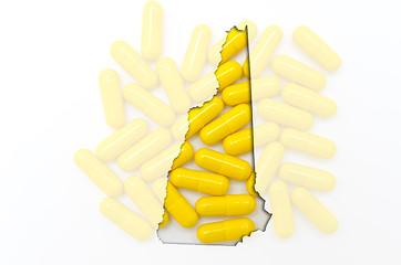 Image showing Outline map of new hampshire with transparent pills in the backg