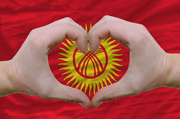 Image showing Heart and love gesture showed by hands over flag of kyrghyzstan 