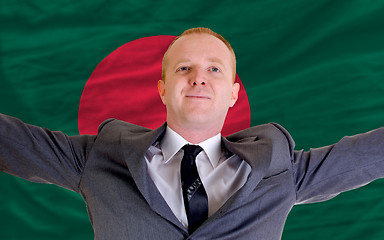 Image showing happy businessman because of profitable investment in bangladesh