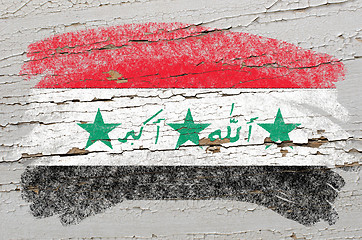 Image showing flag of iraq on grunge wooden texture painted with chalk  