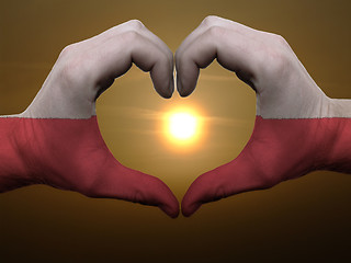 Image showing Heart and love gesture by hands colored in poland flag during be