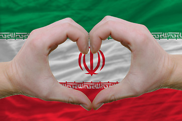Image showing Heart and love gesture showed by hands over flag of iran backgro