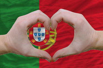 Image showing Heart and love gesture showed by hands over flag of portugal bac