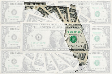 Image showing Outline map of Florida with transparent american dollar banknote