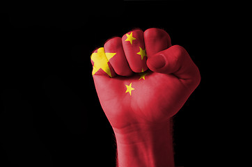 Image showing Fist painted in colors of china flag