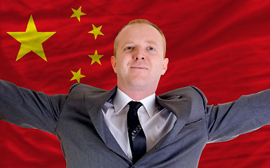 Image showing happy businessman because of profitable investment in china stan
