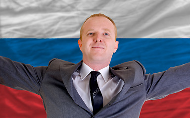 Image showing happy businessman because of profitable investment in russia sta