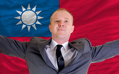 Image showing happy businessman because of profitable investment in taiwan sta