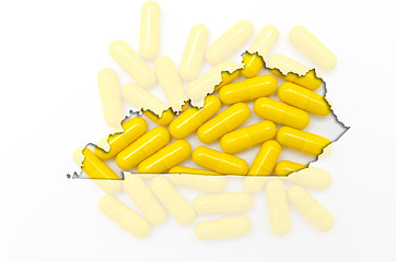 Image showing Outline map of Kentucky with transparent pills in the background