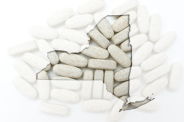 Image showing Outline map of new york with transparent pills in the background