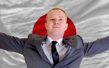 Image showing happy businessman because of profitable investment in japan stan