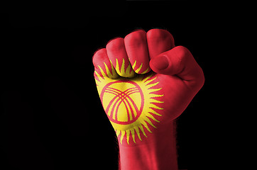 Image showing Fist painted in colors of kyrghyzstan flag