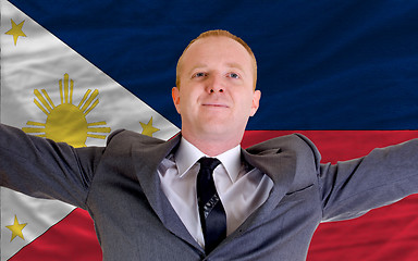 Image showing happy businessman because of profitable investment in phillipine