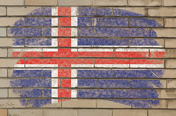 Image showing flag of iceland on grunge brick wall painted with chalk  