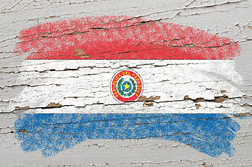Image showing flag of paraguay on grunge wooden texture painted with chalk  
