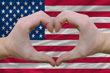 Image showing Heart and love gesture showed by hands over flag of usa backgrou