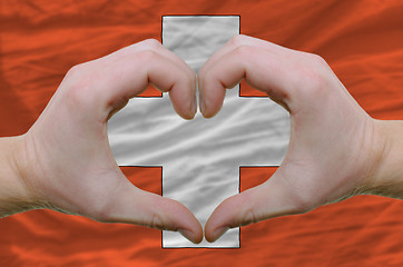 Image showing Heart and love gesture showed by hands over flag of schwitzerlan