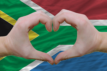 Image showing Heart and love gesture showed by hands over flag of south africa