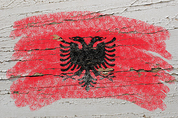 Image showing flag of albania on grunge wooden texture painted with chalk  