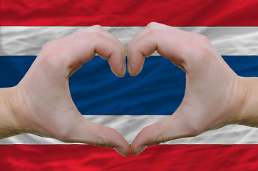 Image showing Heart and love gesture showed by hands over flag of thailand bac