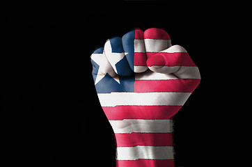 Image showing Fist painted in colors of liberia flag