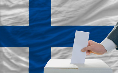 Image showing man voting on elections in finland