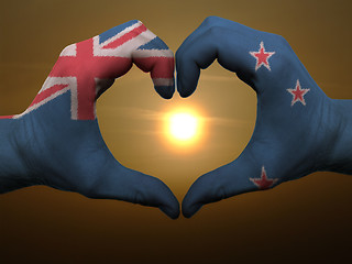 Image showing Heart and love gesture by hands colored in new zealand flag duri