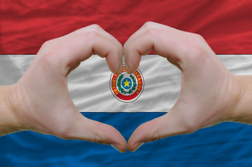 Image showing Heart and love gesture showed by hands over flag of paraguay bac