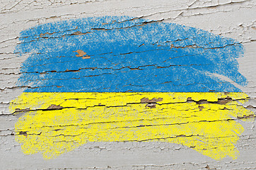 Image showing flag of ukraine on grunge wooden texture painted with chalk  