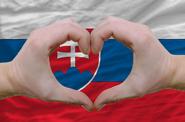 Image showing Heart and love gesture showed by hands over flag of slovakia bac