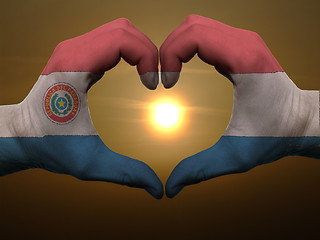 Image showing Heart and love gesture by hands colored in paraguay flag during 