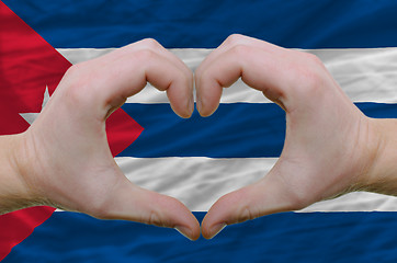 Image showing Heart and love gesture showed by hands over flag of cuba backgro