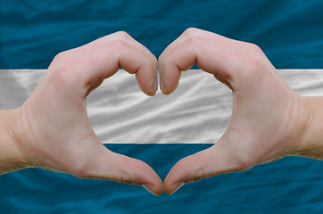 Image showing Heart and love gesture showed by hands over flag of el salvador 