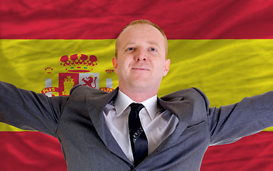 Image showing happy businessman because of profitable investment in spain stan