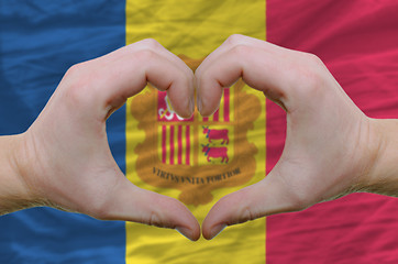 Image showing Heart and love gesture showed by hands over flag of Andora backg