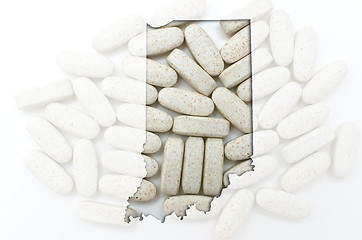 Image showing Outline map of Indiana with transparent pills in the background