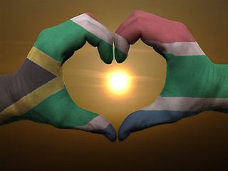 Image showing Heart and love gesture by hands colored in south africa flag dur