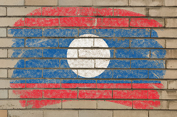 Image showing flag of laos on grunge brick wall painted with chalk  