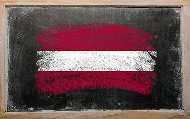 Image showing flag of Latvia on blackboard painted with chalk  