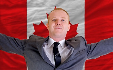 Image showing happy businessman because of profitable investment in canada sta