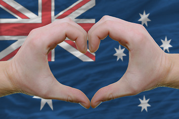 Image showing Heart and love gesture showed by hands over flag of Australia ba