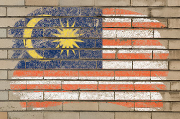 Image showing flag of malaysia on grunge brick wall painted with chalk  