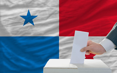 Image showing man voting on elections in panama in front of flag