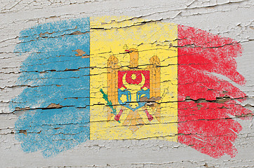 Image showing flag of moldova on grunge wooden texture painted with chalk  