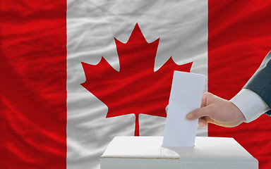 Image showing man voting on elections in canada