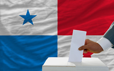 Image showing man voting on elections in panama in front of flag